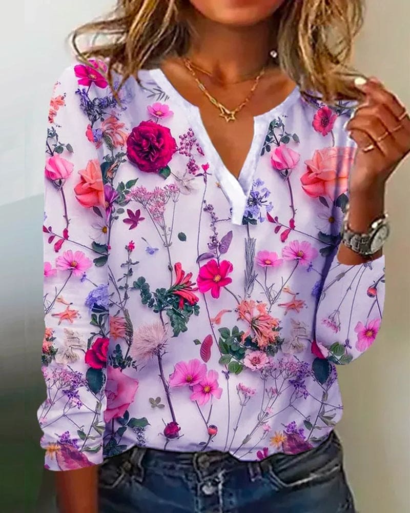 Ariah - Blouse met een versiering van bloemen, een V-hals en lange mouwen