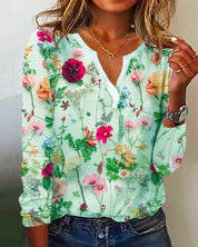 Ariah - Blouse met een versiering van bloemen, een V-hals en lange mouwen